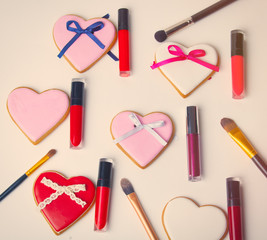 cookies and cosmetics lying on the white background