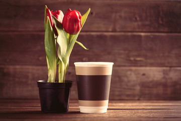 bunch of tulips and cup on the table