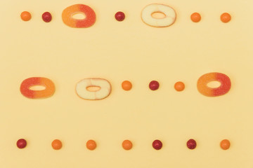 Flat lay fashion pastel palette background with candies