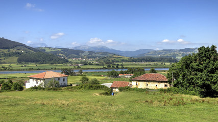 Fototapeta na wymiar Cantabria landscape with field and a small village. Spain.