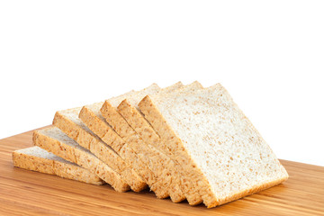 Bread, whole wheat slice on wooden table isolated in white backg