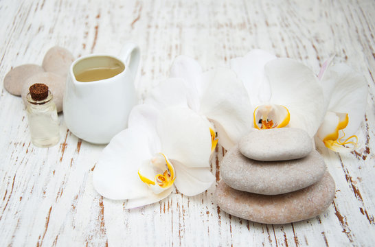 White orchids with massage stones