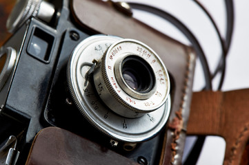 Vintage camera lens in brown leather case