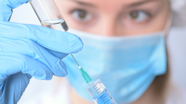 Medical injection in hand, palm or fingers. 