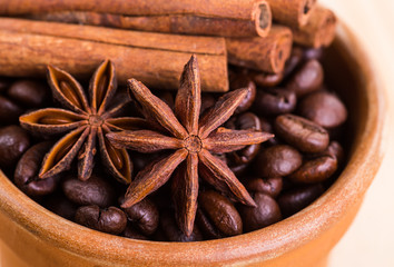 of coffee with coffee beans and cinnamon sticks