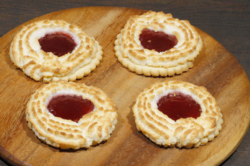 Coconut tartlets stuffed with strawberry jam