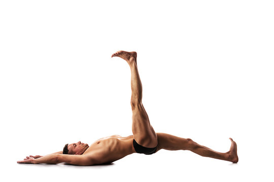 strong
  male doing yoga and fitness, yoga exercises, posture iron bridge
