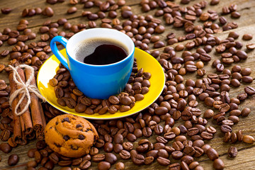 Coffee and coffee bean on wood background