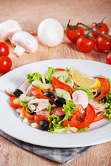 Fresh vegetable salad on the wooden table