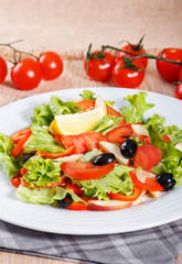 Fresh vegetable salad on the wooden table