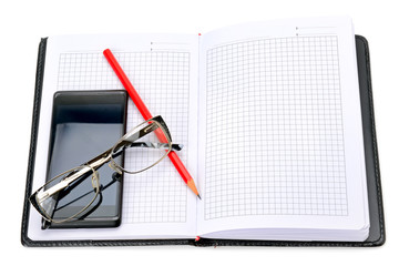 mobile phone, glasses and notebook isolated on white background