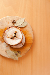 Pork meatloaf on wooden background with spice