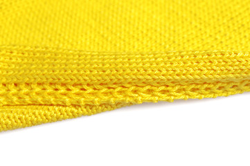 Piece of knitting work - yellow yarn stitches - macro