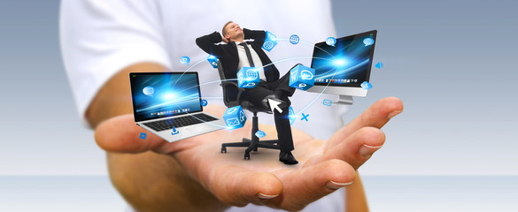 Man on his chair at the office connected to modern devices