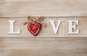 Love wooden text on vintage board background with copy space