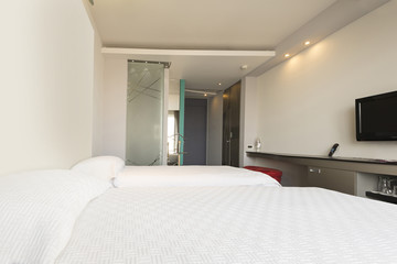 Interior of a double hotel bedroom in the morning