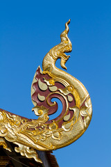 Fototapeta na wymiar Traditional Naga shaped on eave, gable, or roof. Northern Thailand