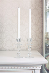 white candle in a glass candlestick