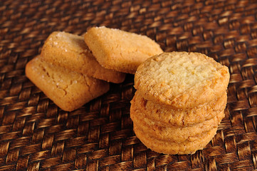 cookies and ear of barley on background