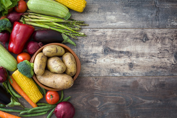 Various vegetables on a rustic wood
