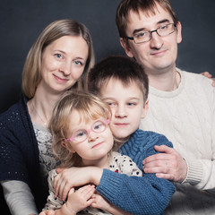 Little Children with Mother and Father. Family