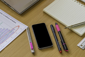 working with digital laptop computer on wooden desk in office.