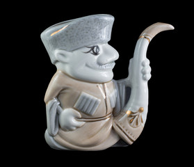ceramic statuette of the Highlander isolated on black
