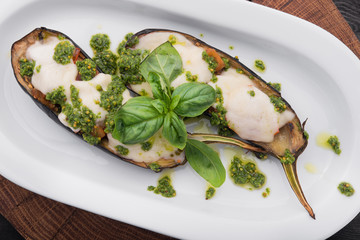 Baked eggplant with cheese and basil