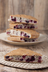 Cake with cranberries and blueberries