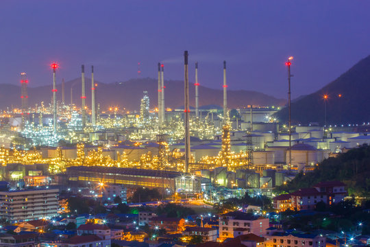 Oil refinery with tube and oil tank along night sky at Si Racha District, Rayong Province, Thailand
