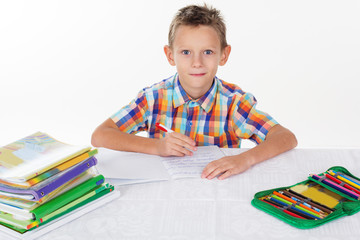 School boy is doing his homework