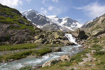 Fototapeta na wymiar High Alps in the Bernese Oberland in Switzerland with creek