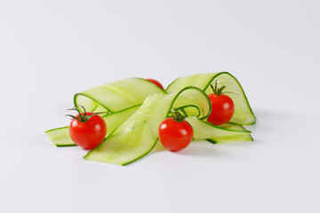 thin cucumber slices and cherry tomatoes