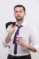 Sick businessman holds coffee cup