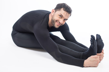 Young male performing yoga