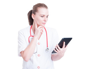 Fototapeta premium Doctor or medic woman using wireless tablet pc
