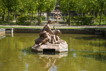 Fototapeta na wymiar golden fountains in segovia palace in Spain. bronze figures of m
