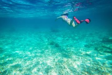 Foto op Canvas Beautiful women snorkeling in the tropical sea © Patryk Kosmider