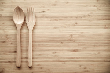 Wooden spoon and fork on table