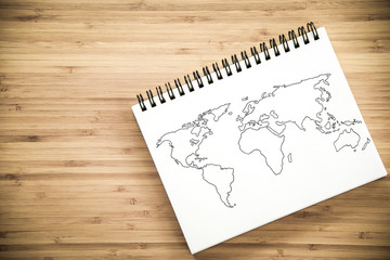 World map outline on notebook