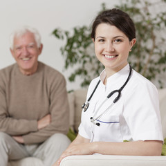 Smiling doctor during home visit