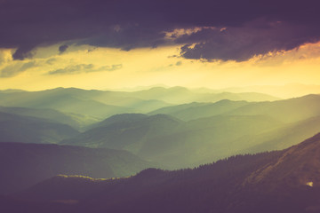 Fototapeta premium Landscape of misty mountain hills in spring.
