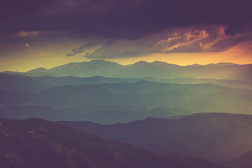 Landscape of misty mountain hills in spring.