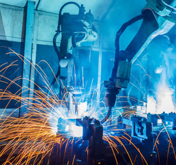 Welding robots movement in a car factory