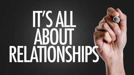 Hand writing the text: Its All About Relationships
