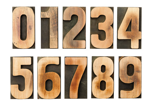 Vintage letterpress numbers printing blocks isolated on white