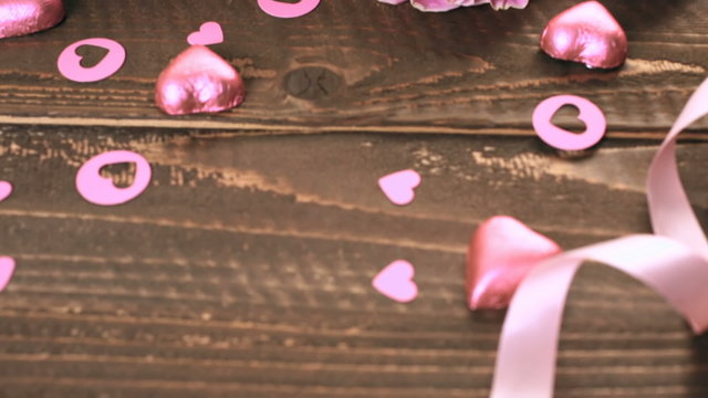 Pink roses on rustic wood table