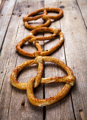 Homemade pastries. Pretzel on wooden background. Food