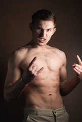 Obraz premium muscular guy without a shirt