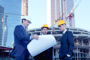 Architects with blueprint